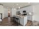 Spacious kitchen with a large island and white cabinets at 6450 Keeton Ln, Harrisburg, NC 28075