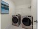 A laundry room includes a washer and dryer and storage shelf at 6450 Keeton Ln, Harrisburg, NC 28075