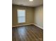 Bedroom with updated floors and natural light at 6520 Farmway Pl, Charlotte, NC 28215