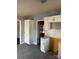 Bright kitchen featuring white cabinets and stainless steel appliances at 6520 Farmway Pl, Charlotte, NC 28215