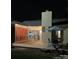 Backyard view at night with a deck, outdoor furniture, and string lights creating a cozy atmosphere at 6721 Old Post Rd, Charlotte, NC 28212