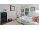 Cozy bedroom with hardwood floors, featuring a large window and comfortable furnishings at 6721 Old Post Rd, Charlotte, NC 28212