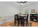 Dining area featuring modern black table and chairs with a ceiling fan and lots of light at 6721 Old Post Rd, Charlotte, NC 28212