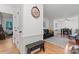 Bright entryway with wood floors, wall decor, and bench seat at 6721 Old Post Rd, Charlotte, NC 28212