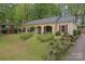 Traditional single-story home with brick facade, red shutters, and mature landscaping at 6721 Old Post Rd, Charlotte, NC 28212