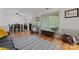 Bright living room featuring hardwood floors, a large window and neutral décor at 6721 Old Post Rd, Charlotte, NC 28212