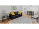 Bright living room with wood flooring is great for entertaining at 6721 Old Post Rd, Charlotte, NC 28212