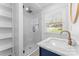 Modern bathroom showcasing sleek glass shower, elegant sink, and contemporary fixtures at 6914 Idlewild Rd, Charlotte, NC 28212