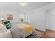 Cozy bedroom with a decorative rug, large closet, and a calming, neutral color palette at 6914 Idlewild Rd, Charlotte, NC 28212