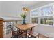 Bright dining area featuring a wooden table set, large windows, and natural light at 6914 Idlewild Rd, Charlotte, NC 28212