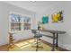 Bright home office featuring large window, desk, and comfortable seating, perfect for remote work at 6914 Idlewild Rd, Charlotte, NC 28212