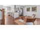 Open kitchen featuring stainless steel appliances, island with seating, and natural light at 6914 Idlewild Rd, Charlotte, NC 28212