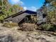 Charming home with a two-car garage and mature landscaping and driveway with trees at 775 Bridgewood Dr, Rock Hill, SC 29732