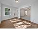 Sunlit living room with hardwood floors, french doors and neutral paint at 775 Bridgewood Dr, Rock Hill, SC 29732