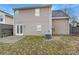 Spacious backyard with a patio area and a mix of grass and mulch at 8005 Mcgarry Trl, Charlotte, NC 28214