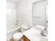 Bathroom with a shower-tub combo, tiled floors, and a large mirror above the vanity at 8005 Mcgarry Trl, Charlotte, NC 28214