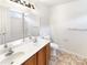 Bathroom with a double vanity, a large mirror, tiled floors, and a shower-tub combination at 8005 Mcgarry Trl, Charlotte, NC 28214