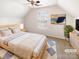 Comfortable bedroom with natural light, carpeted floors, and a ceiling fan at 8005 Mcgarry Trl, Charlotte, NC 28214