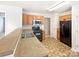Functional kitchen with black appliances, wood cabinets, and laminate countertops at 8005 Mcgarry Trl, Charlotte, NC 28214