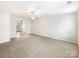Expansive living room features natural light and open space to the dining area at 8005 Mcgarry Trl, Charlotte, NC 28214