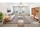 Bright living room with modern decor, neutral walls, and a ceiling fan for added comfort at 8005 Mcgarry Trl, Charlotte, NC 28214