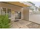 Inviting back patio features a retractable awning, and sliding glass doors at 8009 Whitehawk Hill Rd, Waxhaw, NC 28173