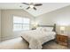 Bright bedroom featuring a ceiling fan, vaulted ceiling, and large windows for natural light at 8009 Whitehawk Hill Rd, Waxhaw, NC 28173