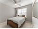 Bedroom featuring neutral walls, soft carpet, and a ceiling fan with natural light at 8009 Whitehawk Hill Rd, Waxhaw, NC 28173
