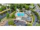 Aerial view of the community pool with a waterslide, splash pad, and clubhouse at 8009 Whitehawk Hill Rd, Waxhaw, NC 28173