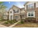 Charming townhome with stone accents, neat landscaping, and inviting entryway at 8009 Whitehawk Hill Rd, Waxhaw, NC 28173