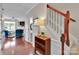 Bright foyer with hardwood floors, staircase, and a view into the living room, creating a welcoming entrance at 8009 Whitehawk Hill Rd, Waxhaw, NC 28173