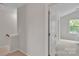 Hallway showcasing neutral paint and access to multiple rooms at 8009 Whitehawk Hill Rd, Waxhaw, NC 28173