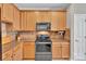 Well-appointed kitchen with stainless steel appliances, ample cabinetry, and a functional layout at 8009 Whitehawk Hill Rd, Waxhaw, NC 28173