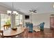 Cozy living room with hardwood floors, fireplace, and ample natural light at 8009 Whitehawk Hill Rd, Waxhaw, NC 28173