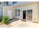 Private outdoor patio with sliding glass door access and partial awning at 8009 Whitehawk Hill Rd, Waxhaw, NC 28173