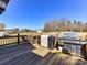 View of back deck including a grill and outdoor dining area with a spacious yard at 816 Springs Rd, Dallas, NC 28034