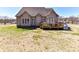 Back exterior of home with deck overlooking spacious yard at 816 Springs Rd, Dallas, NC 28034