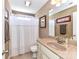 This bathroom features a shower with shower curtain and vanity with granite countertop at 816 Springs Rd, Dallas, NC 28034