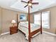 Spacious bedroom featuring a four-poster bed, ceiling fan, and plenty of natural light from the windows at 816 Springs Rd, Dallas, NC 28034