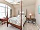 Cozy bedroom features a four-poster bed, arched window, and classic furnishings at 816 Springs Rd, Dallas, NC 28034