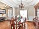 Bright dining room with hardwood floors, wainscoting, and views of the outdoor area at 816 Springs Rd, Dallas, NC 28034