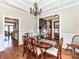 Elegant dining room with hardwood floors, traditional furniture, and access to the kitchen at 816 Springs Rd, Dallas, NC 28034