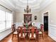 Formal dining room with a chandelier, hardwood floors, and wainscoting at 816 Springs Rd, Dallas, NC 28034