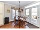 Cozy dining area with a table set for four and natural light from a large window at 816 Springs Rd, Dallas, NC 28034