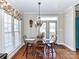 Cozy dining area with a table set for four and natural light from a large window at 816 Springs Rd, Dallas, NC 28034