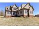 Charming two-story home with brick accents, neutral siding, and a well-manicured lawn at 816 Springs Rd, Dallas, NC 28034