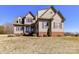 Inviting two-story house features brick accents, neutral siding, and a spacious front yard at 816 Springs Rd, Dallas, NC 28034