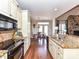 Well-equipped kitchen with island, modern appliances, and seamless flow to dining area at 816 Springs Rd, Dallas, NC 28034
