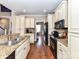Bright kitchen featuring stainless steel appliances, granite counters and hardwood flooring at 816 Springs Rd, Dallas, NC 28034