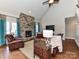 Open living room offers a stone fireplace, hardwood floors, and ample seating at 816 Springs Rd, Dallas, NC 28034